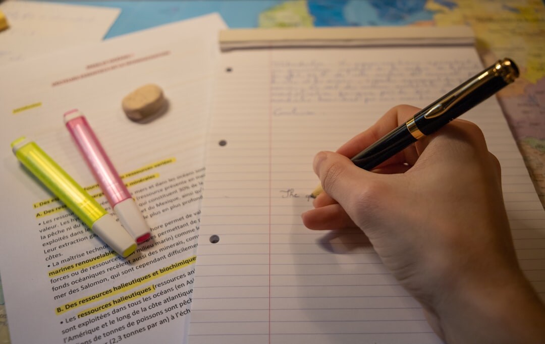 Person writing structured notes and arguments on paper