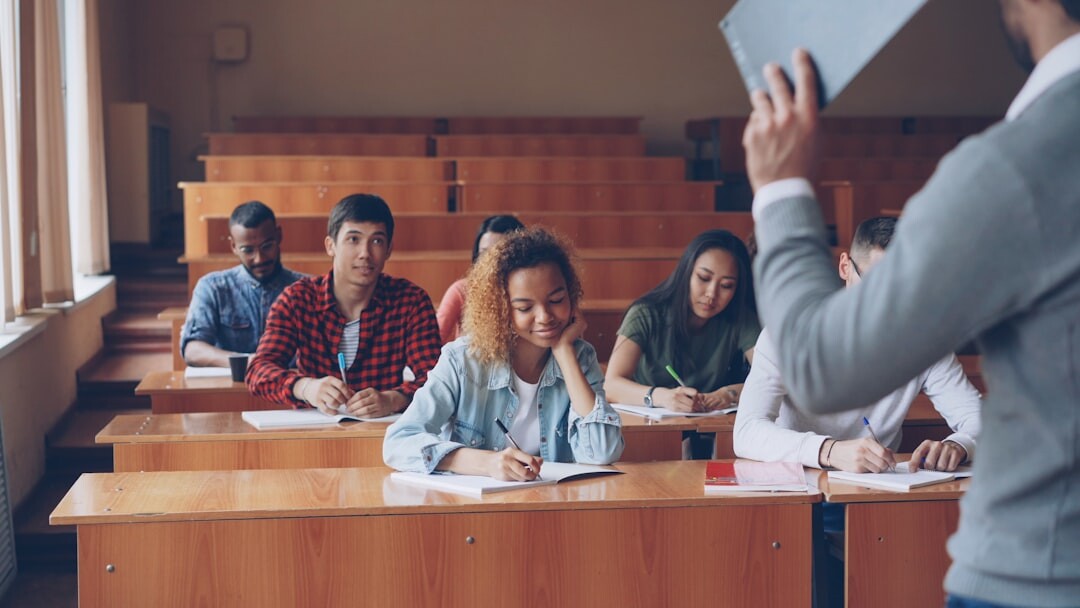 Confident presenter speaking before a large audience in a lecture hall